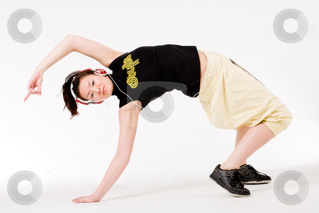 To use this stock image in your creative project, please select the size you need over to the right and click the "Add to Cart" button.
Your downloaded image will come with the Cutcaster watermark removed so don’t worry about the watermark you see on this page. Bending backward stock photo, Young girl enjoying the music and dance on it by Frenk and Danielle Kaufmann