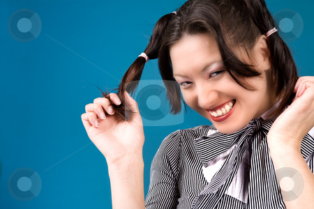 To use this stock image in your creative project, please select the size you need over to the right and click the "Add to Cart" button.
Your downloaded image will come with the Cutcaster watermark removed so don’t worry about the watermark you see on this page. Grinning with my ponytails stock photo, Young girl is happy with her two ponytails by Frenk and Danielle Kaufmann