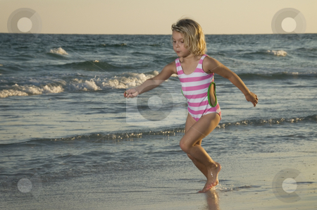 To use this stock image in your creative project, please select the size you need over to the right and click the "Add to Cart" button.
Your downloaded image will come with the Cutcaster watermark removed so don’t worry about the watermark you see on this page. Little girl running on beach stock photo, Little girl running on beach by A Cotton Photo