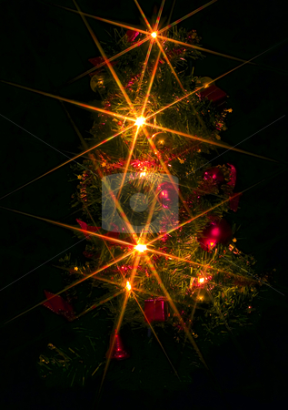 To use this stock image in your creative project, please select the size you need over to the right and click the "Add to Cart" button.
Your downloaded image will come with the Cutcaster watermark removed so don’t worry about the watermark you see on this page. Christmas Tree stock photo, A christmas tree with electric candles on the black background by Petr Koudelka