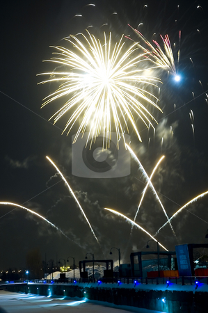 To use this stock image in your creative project, please select the size you need over to the right and click the "Add to Cart" button.
Your downloaded image will come with the Cutcaster watermark removed so don’t worry about the watermark you see on this page. Yellow Fireworks stock photo, Fireworks over the Montreal's Lights Festival by Vlad Podkhlebnik
