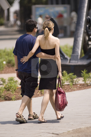 To use this stock image in your creative project, please select the size you need over to the right and click the "Add to Cart" button.
Your downloaded image will come with the Cutcaster watermark removed so don’t worry about the watermark you see on this page. Couple stock photo, A couple walking on the street and holding each other by Vlad Podkhlebnik