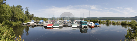 To use this stock image in your creative project, please select the size you need over to the right and click the "Add to Cart" button.
Your downloaded image will come with the Cutcaster watermark removed so don’t worry about the watermark you see on this page. Boats stock photo, Panoramic view of boat docked at a marina by Vlad Podkhlebnik