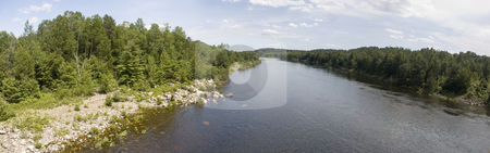 To use this stock image in your creative project, please select the size you need over to the right and click the "Add to Cart" button.
Your downloaded image will come with the Cutcaster watermark removed so don’t worry about the watermark you see on this page. Landscape stock photo, Panoramic view of a river surrounded by forests by Vlad Podkhlebnik