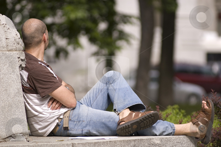 To use this stock image in your creative project, please select the size you need over to the right and click the "Add to Cart" button.
Your downloaded image will come with the Cutcaster watermark removed so don’t worry about the watermark you see on this page. Man relaxing stock photo, A man sitting and relaxing on a sunny day by Vlad Podkhlebnik