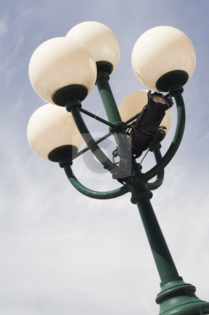 To use this stock image in your creative project, please select the size you need over to the right and click the "Add to Cart" button.
Your downloaded image will come with the Cutcaster watermark removed so don’t worry about the watermark you see on this page. Lamp stock photo, Close up view of a city lamp with a blue sky by Vlad Podkhlebnik