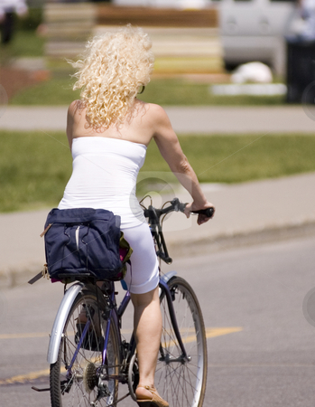 To use this stock image in your creative project, please select the size you need over to the right and click the "Add to Cart" button.
Your downloaded image will come with the Cutcaster watermark removed so don’t worry about the watermark you see on this page. Biking stock photo, A lady riding on a bike by a sunny day by Vlad Podkhlebnik