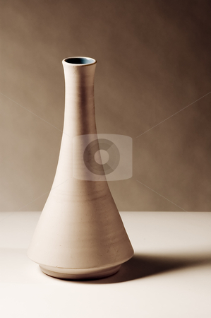 To use this stock image in your creative project, please select the size you need over to the right and click the "Add to Cart" button.
Your downloaded image will come with the Cutcaster watermark removed so don’t worry about the watermark you see on this page. Vase stock photo, Brown ceramic vase on a white table by Vlad Podkhlebnik
