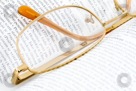 To use this stock image in your creative project, please select the size you need over to the right and click the "Add to Cart" button.
Your downloaded image will come with the Cutcaster watermark removed so don’t worry about the watermark you see on this page. Glasses on Books stock photo, Glasses lying on an open book - close up by Petr Koudelka