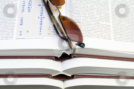 To use this stock image in your creative project, please select the size you need over to the right and click the "Add to Cart" button.
Your downloaded image will come with the Cutcaster watermark removed so don’t worry about the watermark you see on this page. Glasses on Books stock photo, Glasses lying on the pile of books - close up by Petr Koudelka