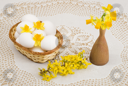 To use this stock image in your creative project, please select the size you need over to the right and click the "Add to Cart" button.
Your downloaded image will come with the Cutcaster watermark removed so don’t worry about the watermark you see on this page. Easter stock photo, A basket of eggs, forsythia and yellow daffodils by Petr Koudelka