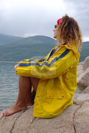 To use this stock image in your creative project, please select the size you need over to the right and click the "Add to Cart" button.
Your downloaded image will come with the Cutcaster watermark removed so don’t worry about the watermark you see on this page. Rain coats stock photo, Semi nude female fashion model wearing a yellow rain coat by Rick Olson