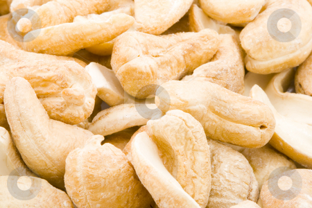 To use this stock image in your creative project, please select the size you need over to the right and click the "Add to Cart" button.
Your downloaded image will come with the Cutcaster watermark removed so don’t worry about the watermark you see on this page. Cashew Nuts stock photo, A close-up of a group of cashew nuts. by Petr Koudelka