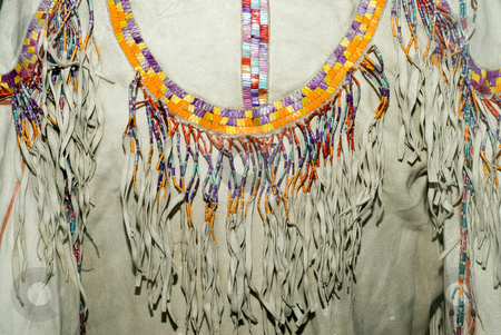 To use this stock image in your creative project, please select the size you need over to the right and click the "Add to Cart" button.
Your downloaded image will come with the Cutcaster watermark removed so don’t worry about the watermark you see on this page. Native American Shirt stock photo, Closeup of a Native American shirt made of animal hide and decorated with beads by Richard Nelson