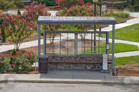 To use this stock image in your creative project, please select the size you need over to the right and click the "Add to Cart" button.
Your downloaded image will come with the Cutcaster watermark removed so don’t worry about the watermark you see on this page. Bus Stop stock photo, An empty bus stop waiting for passengers. by Robert Byron