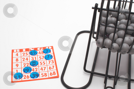 To use this stock image in your creative project, please select the size you need over to the right and click the "Add to Cart" button.
Your downloaded image will come with the Cutcaster watermark removed so don’t worry about the watermark you see on this page. Bingo Cage and Card stock photo, A bingo cage, balls with numbers, card and markers. by Robert Byron