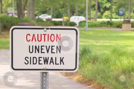 To use this stock image in your creative project, please select the size you need over to the right and click the "Add to Cart" button.
Your downloaded image will come with the Cutcaster watermark removed so don’t worry about the watermark you see on this page. Caution Uneven Sidewalk stock photo, A sign in a park stating Caution Uneven Sidewalk by Robert Byron