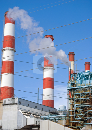 To use this stock image in your creative project, please select the size you need over to the right and click the "Add to Cart" button.
Your downloaded image will come with the Cutcaster watermark removed so don’t worry about the watermark you see on this page. Smoke Stacks stock photo, Red whtie and blue smoke stacks at an oil refinery by Robert Cabrera