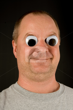 To use this stock image in your creative project, please select the size you need over to the right and click the "Add to Cart" button.
Your downloaded image will come with the Cutcaster watermark removed so don’t worry about the watermark you see on this page. Silly Man stock photo, A silly man with wiggly googly eyes. by Robert Byron