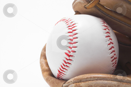 To use this stock image in your creative project, please select the size you need over to the right and click the "Add to Cart" button.
Your downloaded image will come with the Cutcaster watermark removed so don’t worry about the watermark you see on this page. Baseball and Baseball Glove stock photo, A baseball inside of a baseball glove. by Robert Byron