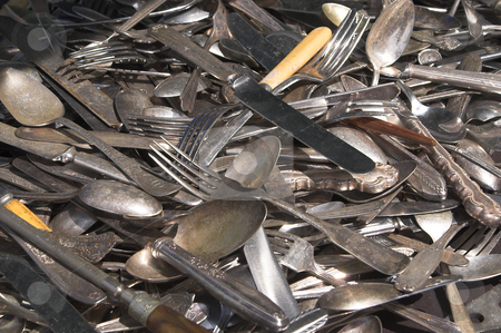 To use this stock image in your creative project, please select the size you need over to the right and click the "Add to Cart" button.
Your downloaded image will come with the Cutcaster watermark removed so don’t worry about the watermark you see on this page. Antique Silverware stock photo, A large mixed pile of antique silverware. by Robert Byron