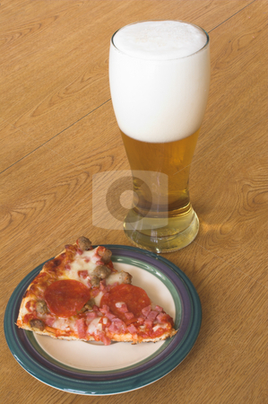 To use this stock image in your creative project, please select the size you need over to the right and click the "Add to Cart" button.
Your downloaded image will come with the Cutcaster watermark removed so don’t worry about the watermark you see on this page. Pizza and Beer stock photo, A slice of pizza and a beer in a pilsner glass. by Robert Byron