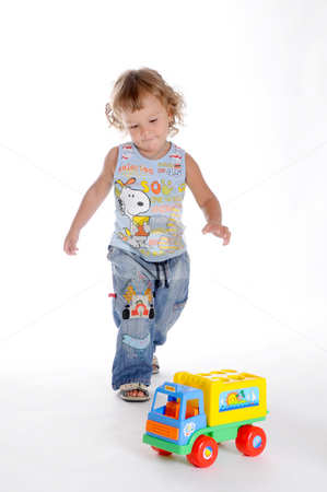 To use this stock image in your creative project, please select the size you need over to the right and click the "Add to Cart" button.
Your downloaded image will come with the Cutcaster watermark removed so don’t worry about the watermark you see on this page. Boy and Toy Car 3 stock photo, Little Curly-headed Boy and Toy Car by Valeriy Mazur