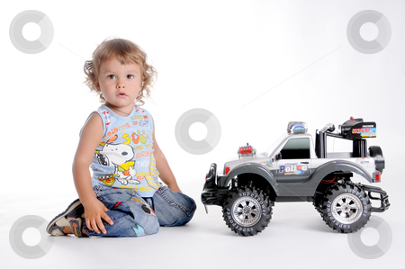To use this stock image in your creative project, please select the size you need over to the right and click the "Add to Cart" button.
Your downloaded image will come with the Cutcaster watermark removed so don’t worry about the watermark you see on this page. Boy and Toy Car 2 stock photo, Little Curly-headed Boy and Toy Car by Valeriy Mazur