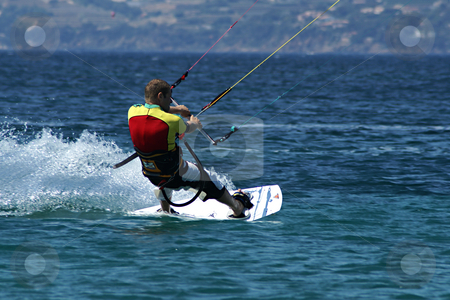 To use this stock image in your creative project, please select the size you need over to the right and click the "Add to Cart" button.
Your downloaded image will come with the Cutcaster watermark removed so don’t worry about the watermark you see on this page. Kite Boarder stock photo, Kite boarder on run at full speed by Serge VILLA