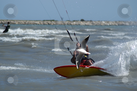 To use this stock image in your creative project, please select the size you need over to the right and click the "Add to Cart" button.
Your downloaded image will come with the Cutcaster watermark removed so don’t worry about the watermark you see on this page. The seagull and the kite boarder stock photo, Kite surfer backside at full speed by Serge VILLA