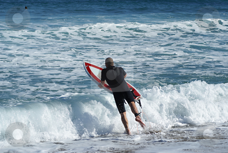 To use this stock image in your creative project, please select the size you need over to the right and click the "Add to Cart" button.
Your downloaded image will come with the Cutcaster watermark removed so don’t worry about the watermark you see on this page. Jumping in the wave stock photo, Surfer leaving the beach (French Riviera) by Serge VILLA