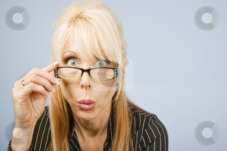 To use this stock image in your creative project, please select the size you need over to the right and click the "Add to Cart" button.
Your downloaded image will come with the Cutcaster watermark removed so don’t worry about the watermark you see on this page. Woman Looking Over Her Glasses stock photo, Businesswoman looking over the top of her glasses by Scott Griessel