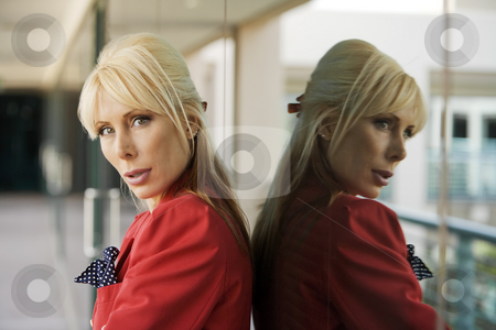 To use this stock image in your creative project, please select the size you need over to the right and click the "Add to Cart" button.
Your downloaded image will come with the Cutcaster watermark removed so don’t worry about the watermark you see on this page. Beautiful Blonde Businesswoman stock photo, Blonde Businesswoman leaning against a reflective surface by Scott Griessel