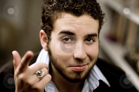 To use this stock image in your creative project, please select the size you need over to the right and click the "Add to Cart" button.
Your downloaded image will come with the Cutcaster watermark removed so don’t worry about the watermark you see on this page. Handsome Young Man stock photo, Portrait of handsome young man with beard gesturing with his hand by Scott Griessel