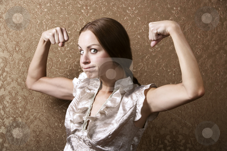 To use this stock image in your creative project, please select the size you need over to the right and click the "Add to Cart" button.
Your downloaded image will come with the Cutcaster watermark removed so don’t worry about the watermark you see on this page. Young Woman Flexing Her Biceps stock photo, Portrait of a Pretty Young Woman Flexing Her Biceps by Scott Griessel