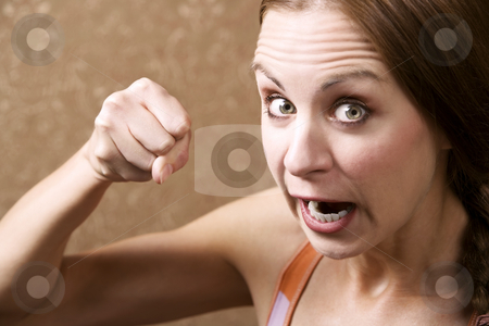 To use this stock image in your creative project, please select the size you need over to the right and click the "Add to Cart" button.
Your downloaded image will come with the Cutcaster watermark removed so don’t worry about the watermark you see on this page. Angry Woman Throwing a Punch stock photo, Angry Young Woman in Front of Gold wallpaper Throwing a Punch by Scott Griessel