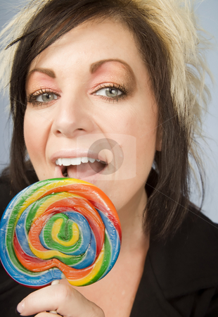 To use this stock image in your creative project, please select the size you need over to the right and click the "Add to Cart" button.
Your downloaded image will come with the Cutcaster watermark removed so don’t worry about the watermark you see on this page. Creative Businesswoman with a Lollipop stock photo, Portrait of a creative businesswoman with wild hair holding a lollipop by Scott Griessel