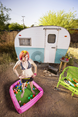 To use this stock image in your creative project, please select the size you need over to the right and click the "Add to Cart" button.
Your downloaded image will come with the Cutcaster watermark removed so don’t worry about the watermark you see on this page. Woman outside a trailer stock photo, Woman standing in a play pool outside a trailer by Scott Griessel