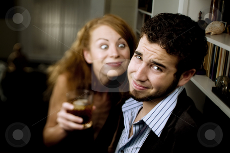 To use this stock image in your creative project, please select the size you need over to the right and click the "Add to Cart" button.
Your downloaded image will come with the Cutcaster watermark removed so don’t worry about the watermark you see on this page. Woman Leers at Man at Party stock photo, Woman pursuing a man at a party makes him uncomfortable by Scott Griessel