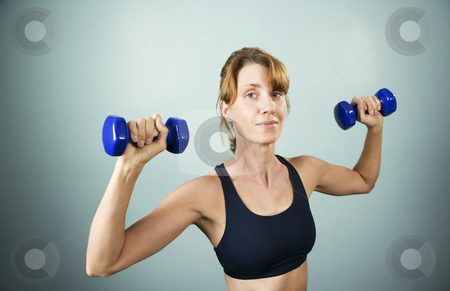 To use this stock image in your creative project, please select the size you need over to the right and click the "Add to Cart" button.
Your downloaded image will come with the Cutcaster watermark removed so don’t worry about the watermark you see on this page. Woman with Dumbbells stock photo, Pretty athletic woman working out with dumbbells by Scott Griessel