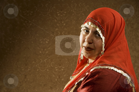 To use this stock image in your creative project, please select the size you need over to the right and click the "Add to Cart" button.
Your downloaded image will come with the Cutcaster watermark removed so don’t worry about the watermark you see on this page. Muslim Woman stock photo, Portrait of a Muslim Woman in a Red Head Scarf by Scott Griessel