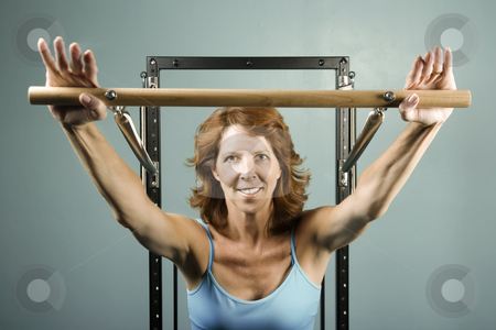 To use this stock image in your creative project, please select the size you need over to the right and click the "Add to Cart" button.
Your downloaded image will come with the Cutcaster watermark removed so don’t worry about the watermark you see on this page. Woman doing a strength workout stock photo, Woman using gym equipment to do a strength workout by Scott Griessel