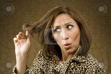 To use this stock image in your creative project, please select the size you need over to the right and click the "Add to Cart" button.
Your downloaded image will come with the Cutcaster watermark removed so don’t worry about the watermark you see on this page. Hispanic Woman Twists her Hair stock photo, Hispanic Woman in Leopard Print Coat with Big Hair by Scott Griessel