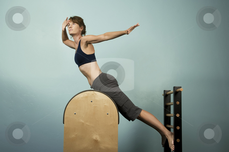 To use this stock image in your creative project, please select the size you need over to the right and click the "Add to Cart" button.
Your downloaded image will come with the Cutcaster watermark removed so don’t worry about the watermark you see on this page. Woman Exercising stock photo, Athletic Woman Exercising and Stretching on Gym Equipment by Scott Griessel