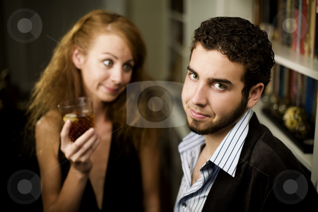 To use this stock image in your creative project, please select the size you need over to the right and click the "Add to Cart" button.
Your downloaded image will come with the Cutcaster watermark removed so don’t worry about the watermark you see on this page. Woman looks lovingly at young man stock photo, Young woman with big hair looks lovingly at young man by Scott Griessel
