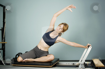 To use this stock image in your creative project, please select the size you need over to the right and click the "Add to Cart" button.
Your downloaded image will come with the Cutcaster watermark removed so don’t worry about the watermark you see on this page. Pilates Workout stock photo, Pretty Woman Working Out on Pilates Equipment by Scott Griessel