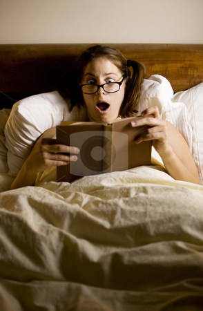 To use this stock image in your creative project, please select the size you need over to the right and click the "Add to Cart" button.
Your downloaded image will come with the Cutcaster watermark removed so don’t worry about the watermark you see on this page. Woman Reading in Bed stock photo, Woman reading in bed with a shocked expression by Scott Griessel