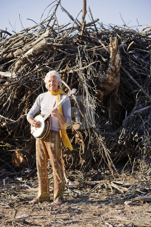 To use this stock image in your creative project, please select the size you need over to the right and click the "Add to Cart" button.
Your downloaded image will come with the Cutcaster watermark removed so don’t worry about the watermark you see on this page. Barefoot Banjo Player stock photo, Barefoot banjo Player in Front of a Big Pile of Wood by Scott Griessel