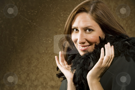 To use this stock image in your creative project, please select the size you need over to the right and click the "Add to Cart" button.
Your downloaded image will come with the Cutcaster watermark removed so don’t worry about the watermark you see on this page. Pretty Hispanic Woman Wearing Feathers stock photo, Pretty Hispanic Woman Wearing a Feather Boa in front of Gold Wallpaper by Scott Griessel