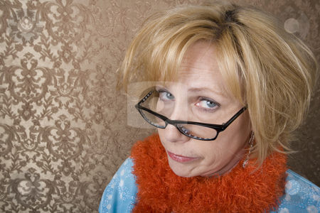 To use this stock image in your creative project, please select the size you need over to the right and click the "Add to Cart" button.
Your downloaded image will come with the Cutcaster watermark removed so don’t worry about the watermark you see on this page. Crazy Woman stock photo, Crazy woman with glasses suspiciouly eyeing the camera by Scott Griessel